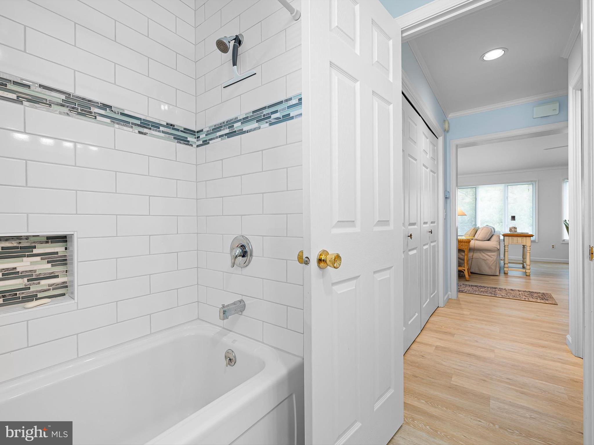 532 Bethany Loop Bethany Beach, DE 19930 - Photo 28 of 65 a bathroom with a bathtub and a shower