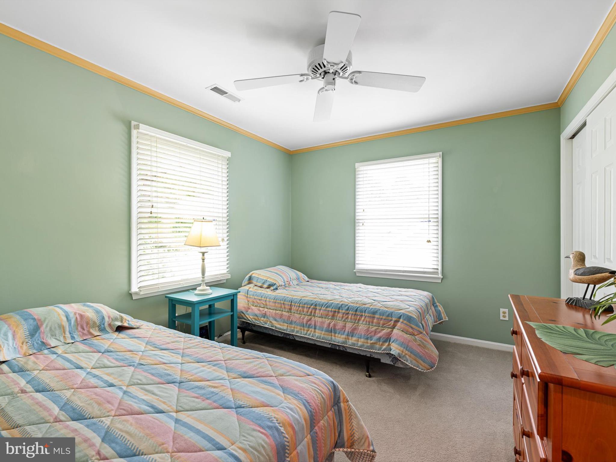 532 Bethany Loop Bethany Beach, DE 19930 - Photo 29 of 65 a bedroom with two beds and a table