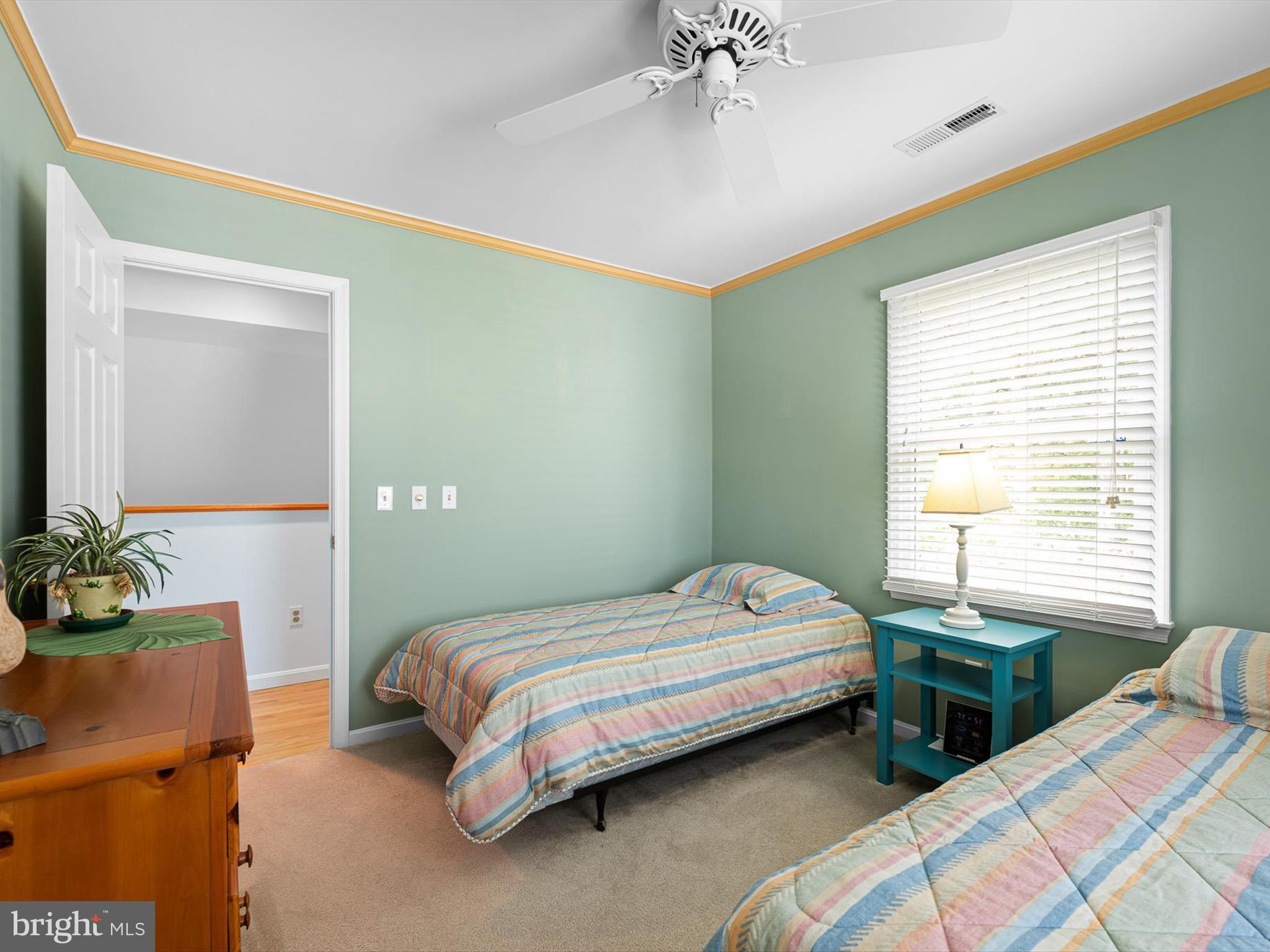 532 Bethany Loop Bethany Beach, DE 19930 - Photo 30 of 65 a bedroom with a bed and a table