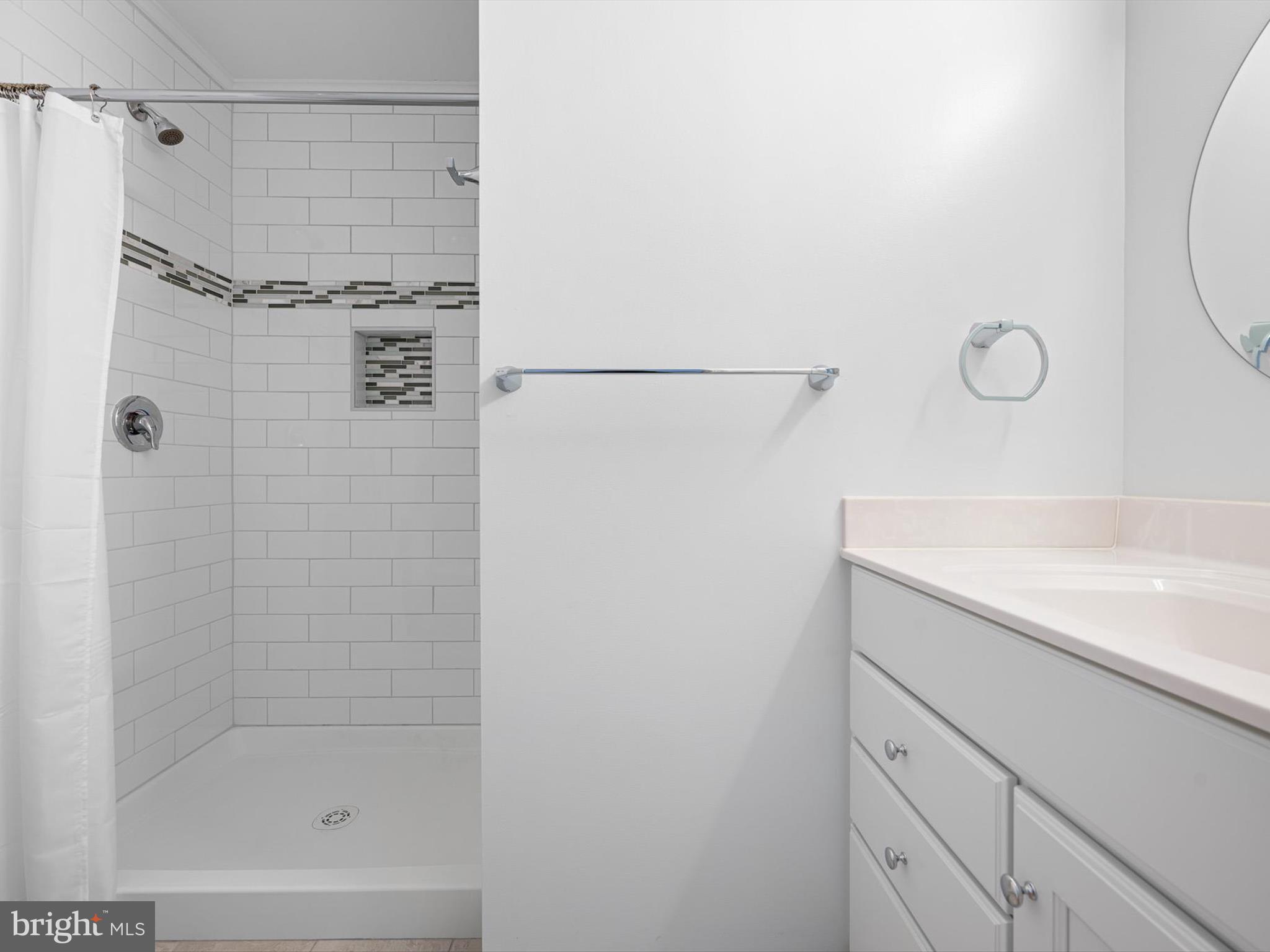 532 Bethany Loop Bethany Beach, DE 19930 - Photo 31 of 65 a bathroom with a shower and a sink