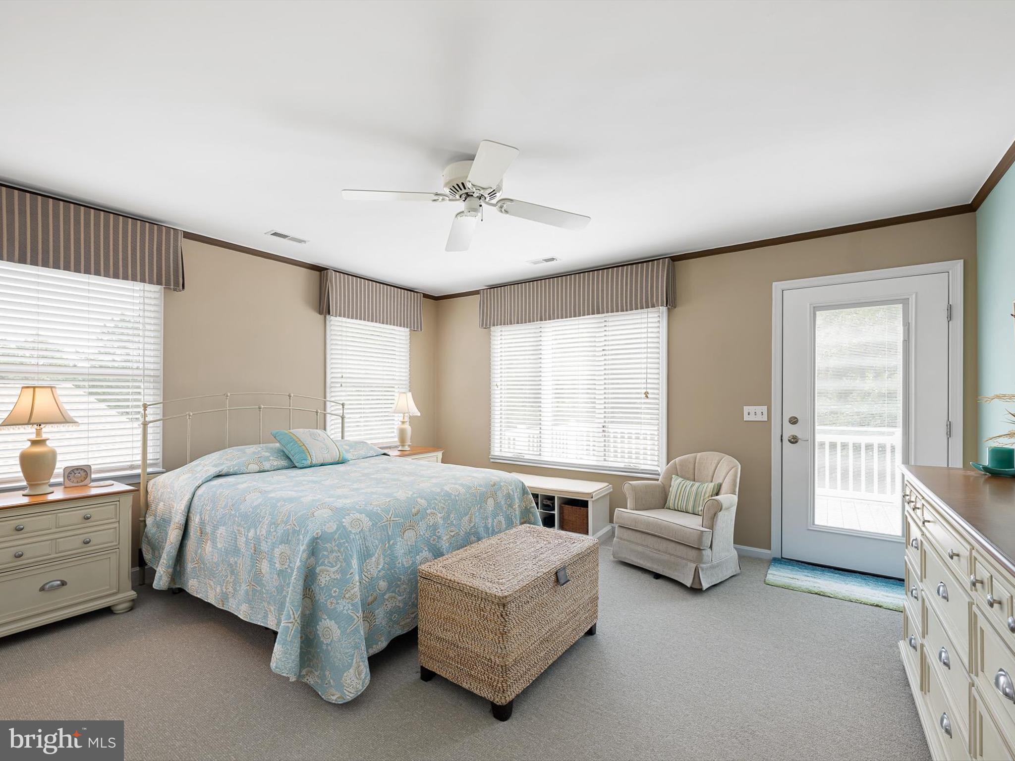 532 Bethany Loop Bethany Beach, DE 19930 - Photo 32 of 65 a spacious bedroom with a bed and a couch