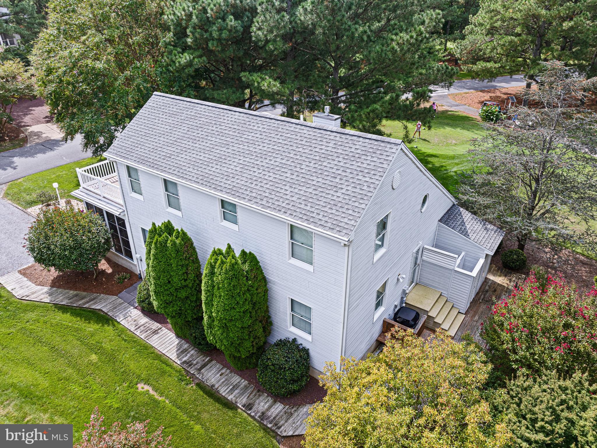 532 Bethany Loop Bethany Beach, DE 19930 - Photo 7 of 65 an aerial view of a house with a yard and plants