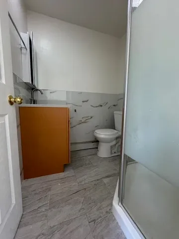 a bathroom with a toilet and a sink