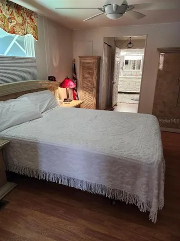 a living room with hard wood floors and a couch