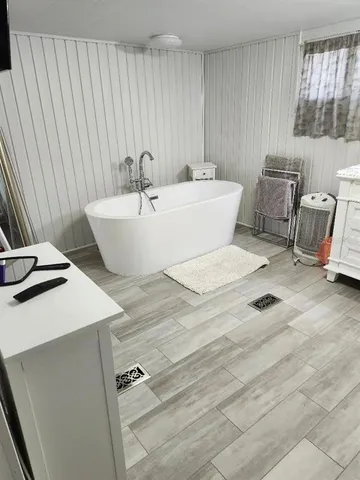 a view of a bathroom with a toilet and a shower