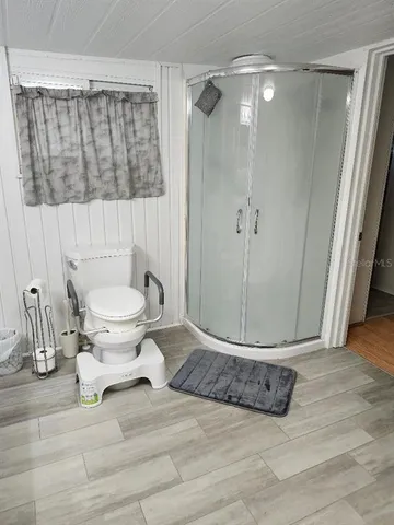 a bedroom with a bed and a cabinets