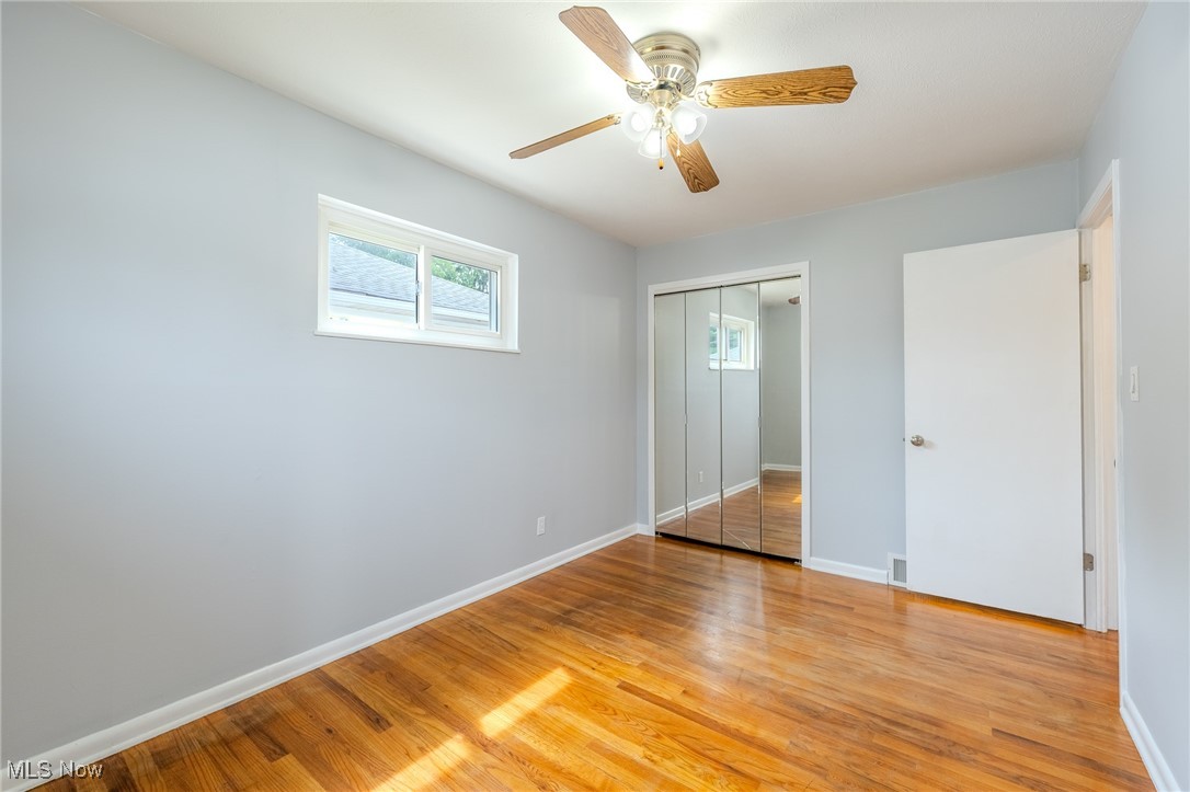 29971 Regent Road Wickliffe, OH 44092 - Photo 21 of 39 Unfurnished bedroom featuring light wood-style floors, a closet, and a ceiling fan