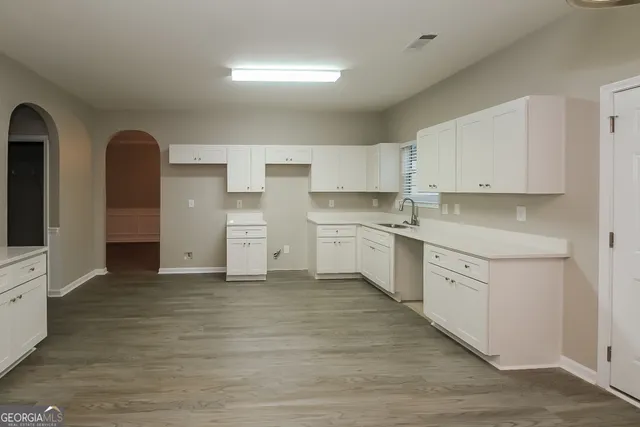 a kitchen with stainless steel appliances cabinets a sink and a stove