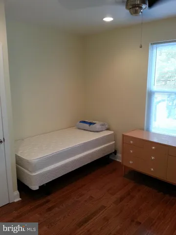 a spacious bathroom with a bathtub and window
