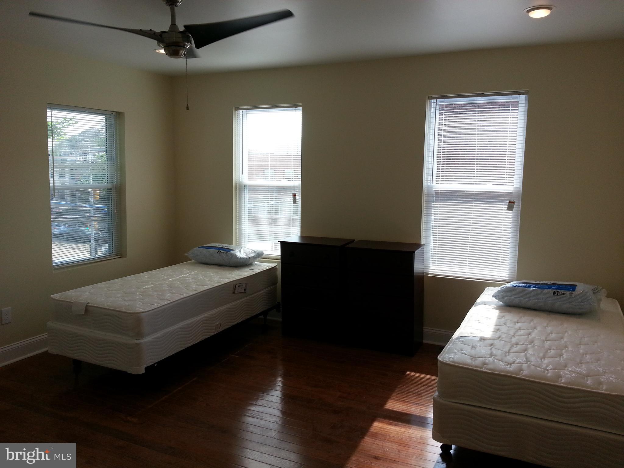 500 North 39th Street Philadelphia, PA 19104 - Photo 15 of 26 a bedroom with a bed and wooden floor