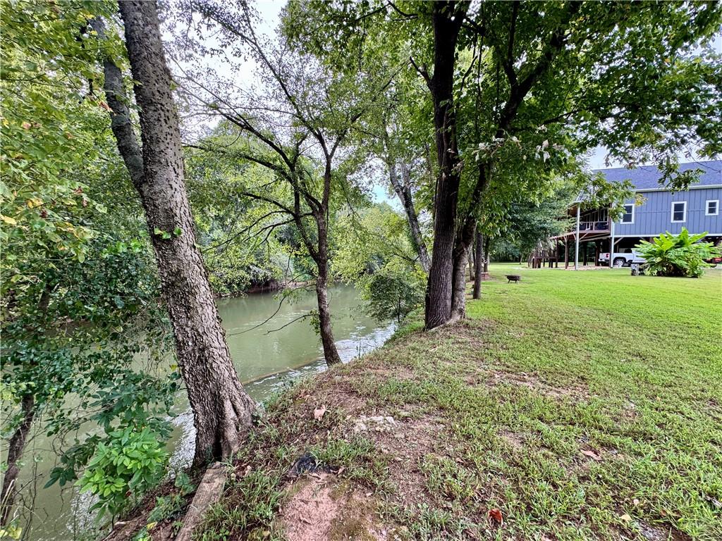250 Hook Road Northeast Ranger, GA 30734 - Photo 109 of 114 a big yard with flowing stream of water in middle