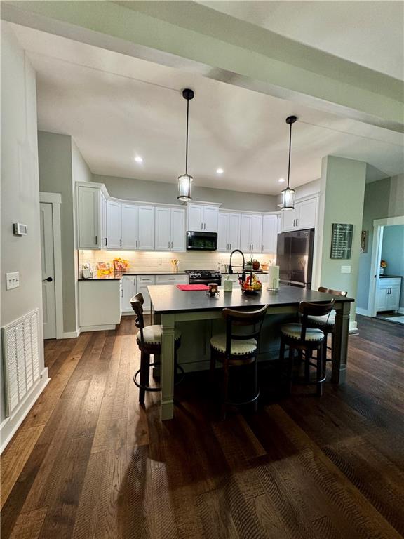 250 Hook Road Northeast Ranger, GA 30734 - Photo 28 of 114 a kitchen with a table chairs refrigerator and microwave