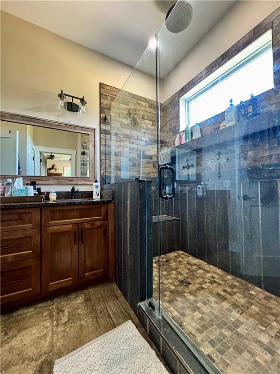 250 Hook Road Northeast Ranger, GA 30734 - Photo 29 of 114 a bathroom with a granite countertop sink a mirror and shower