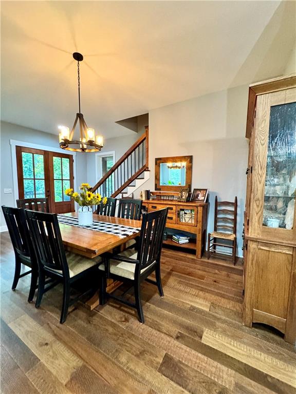 250 Hook Road Northeast Ranger, GA 30734 - Photo 37 of 114 a dining room with furniture a rug and wooden floor