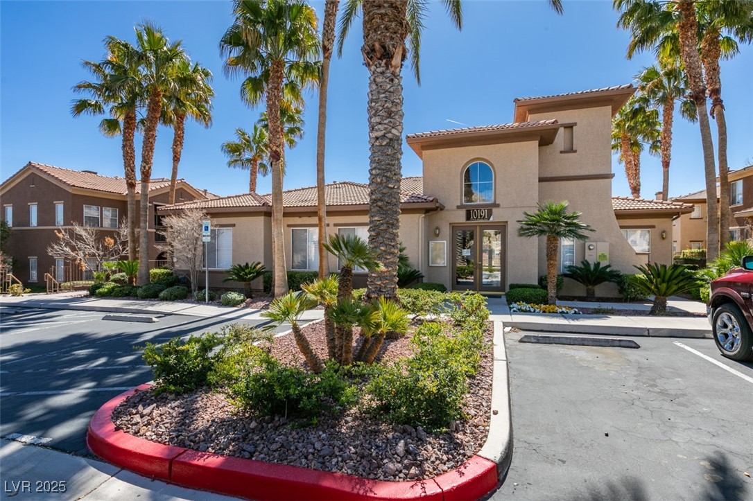 10220 Delray Beach Avenue, Unit 103 Las Vegas, NV 89129 - Photo 40 of 42 View of building exterior with uncovered parking