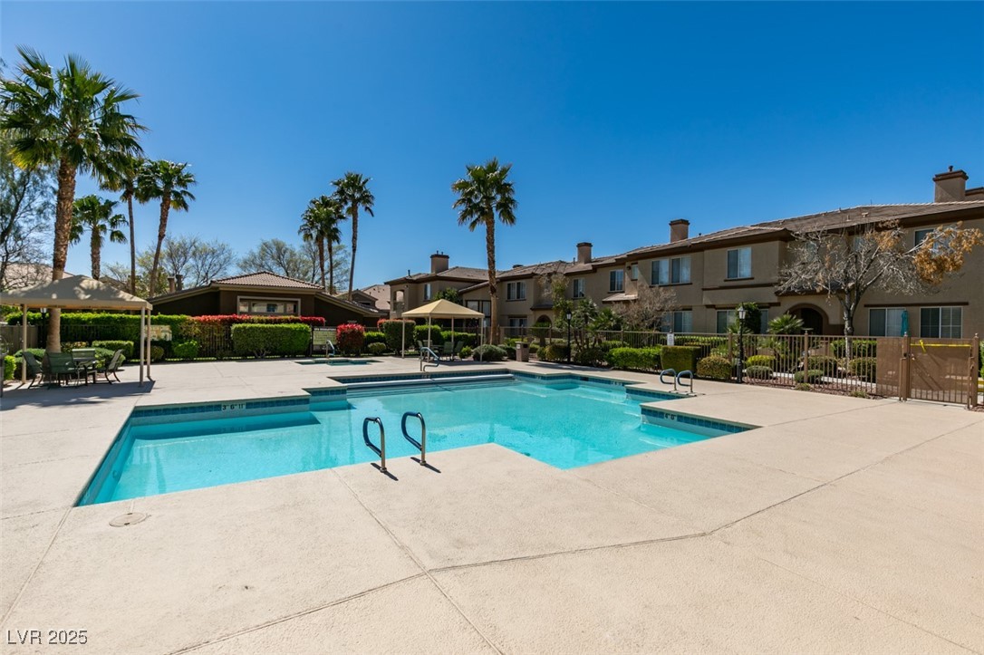 10220 Delray Beach Avenue, Unit 103 Las Vegas, NV 89129 - Photo 41 of 42 Pool with a patio area, a residential view, and fence