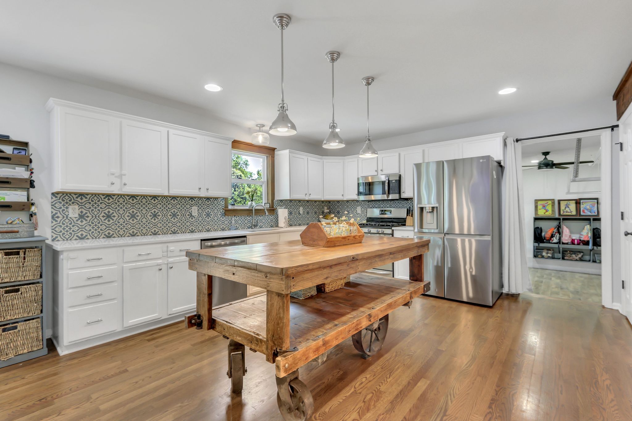 1716 Shane Drive Spring Hill, TN 37174 - Photo 11 of 34 a kitchen with refrigerator a stove and wooden floor