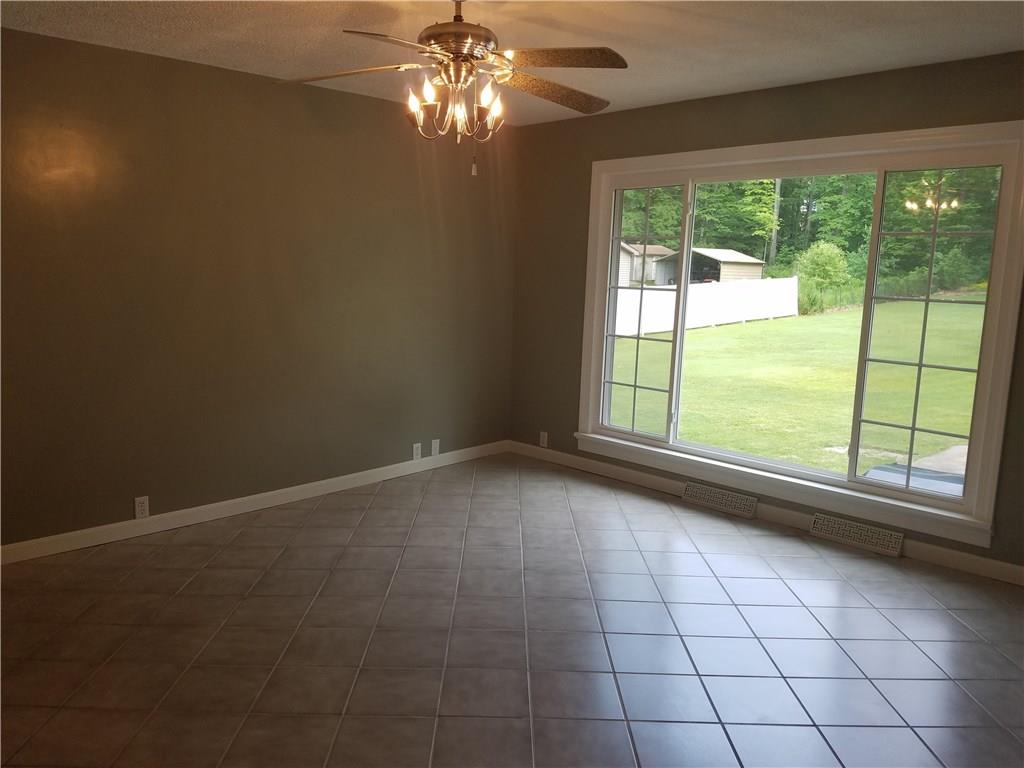 3306 Morefield Road Hermitage, PA 16148 - Photo 8 of 14 Spacious dining room with ceramic flooring, large window to views of rear yard.