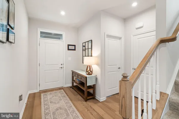 a front view of a house with a garden and plants