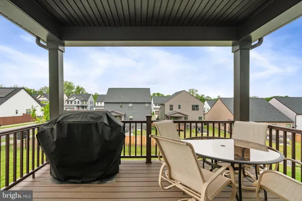 a kitchen with a table chairs stove and kitchen island