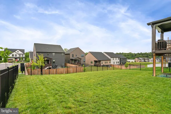 a living room with furniture a window and a flat screen tv
