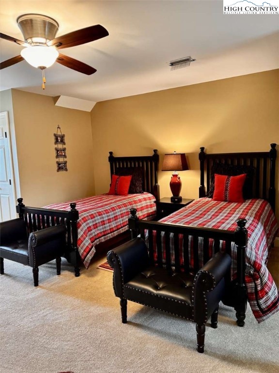 167 Elliott Circle, Unit D1 Blowing Rock, NC 28605 - Photo 17 of 25 a bedroom with a bed and wooden floor