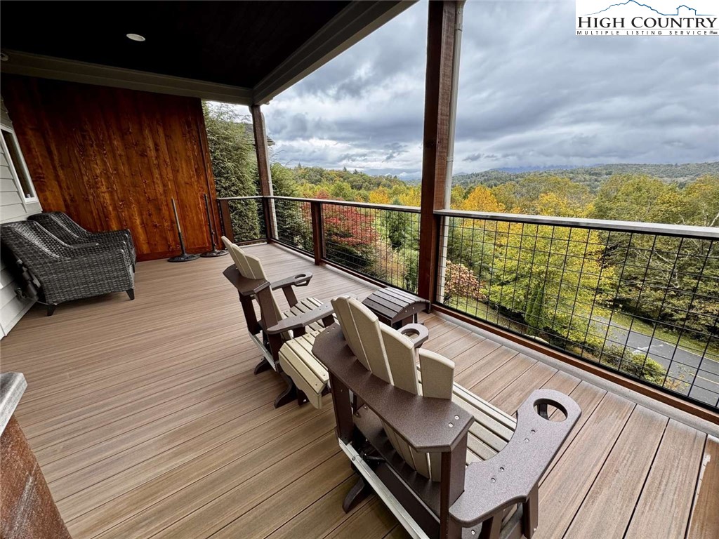 167 Elliott Circle, Unit D1 Blowing Rock, NC 28605 - Photo 22 of 25 a view of sitting area with furniture and wooden deck