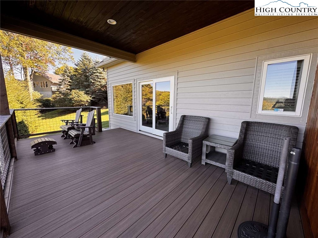 167 Elliott Circle, Unit D1 Blowing Rock, NC 28605 - Photo 23 of 25 a view of a two chairs in the balcony