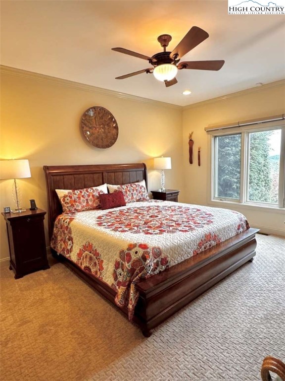 167 Elliott Circle, Unit D1 Blowing Rock, NC 28605 - Photo 8 of 25 a bedroom with a bed and painting on the wall