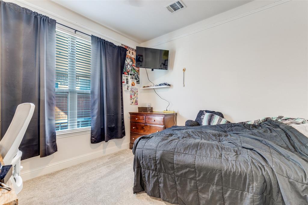 15193 Basket Oak Road Frisco, TX 75035 - Photo 17 of 40 Bedroom with carpet floors and baseboards