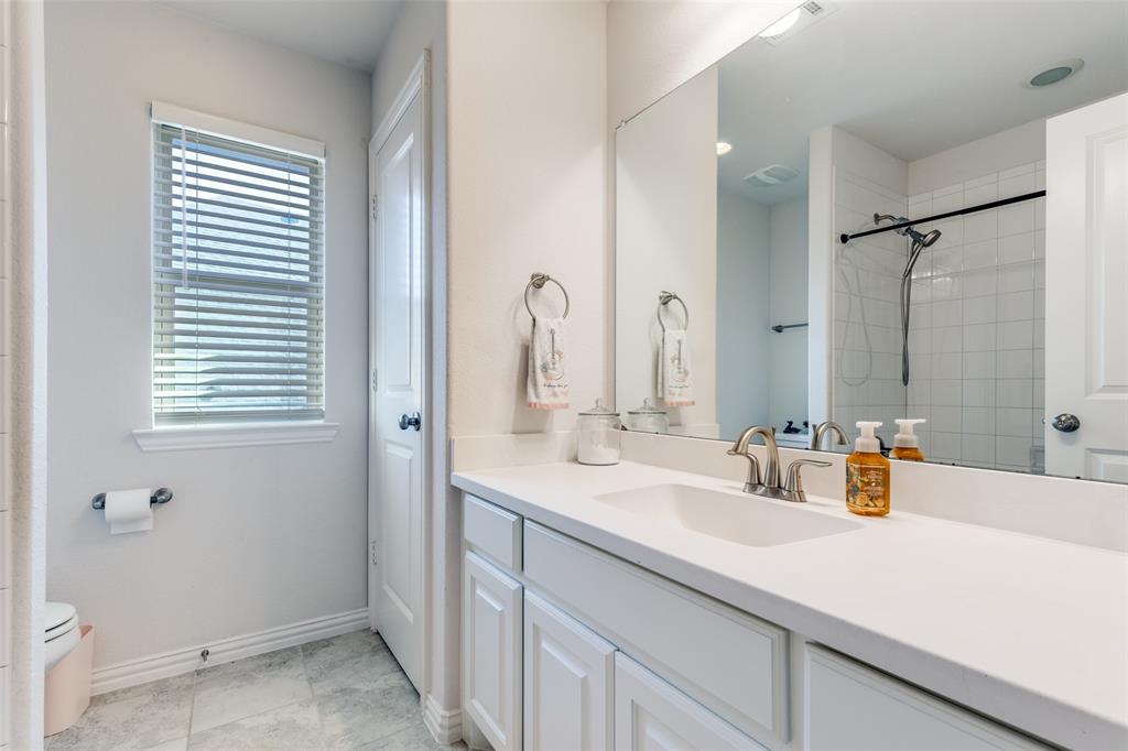 15193 Basket Oak Road Frisco, TX 75035 - Photo 20 of 40 Full bath with vanity and tiled shower