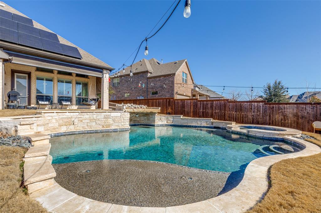 15193 Basket Oak Road Frisco, TX 75035 - Photo 31 of 40 a view of a backyard with swimming pool