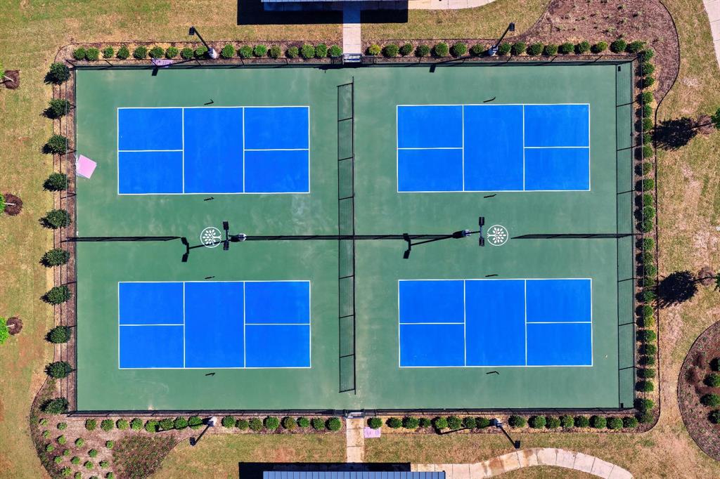 15193 Basket Oak Road Frisco, TX 75035 - Photo 37 of 40 Four blue and green outdoor courts, surrounded by manicured landscaping and grass, offer recreational opportunities