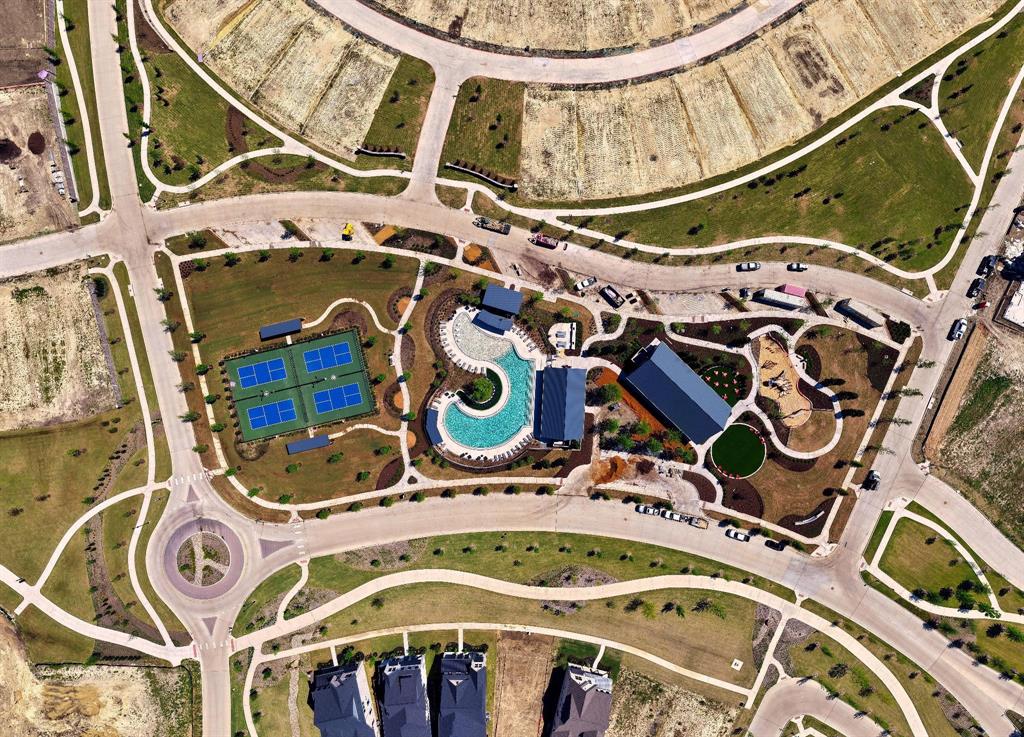 15193 Basket Oak Road Frisco, TX 75035 - Photo 38 of 40 Aerial view highlighting the community's amenities, featuring tennis courts, a swimming pool, and dedicated recreational areas