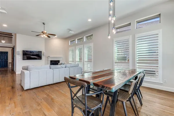 a view of a dining room with furniture and a chandelier