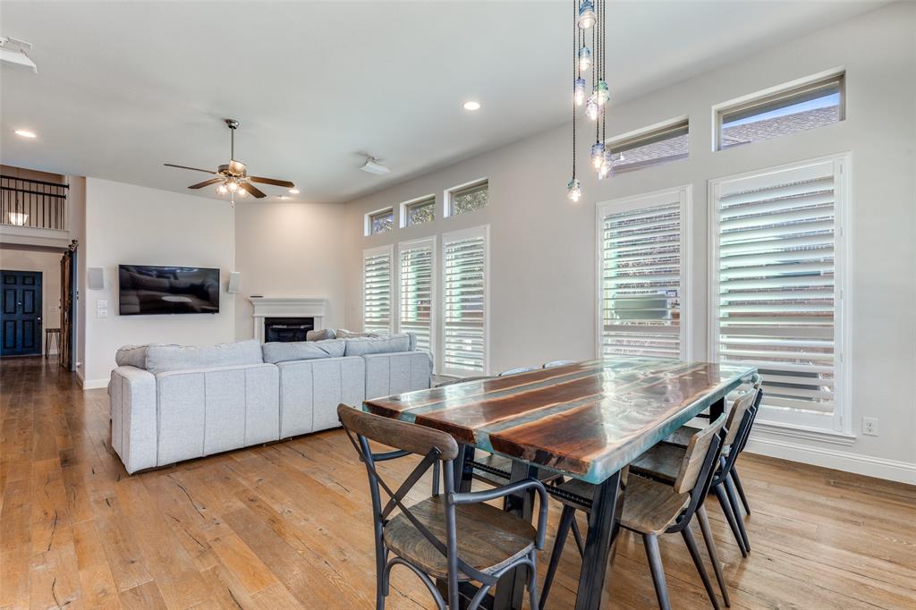 15193 Basket Oak Road Frisco, TX 75035 - Photo 9 of 40 a view of a dining room with furniture and a chandelier