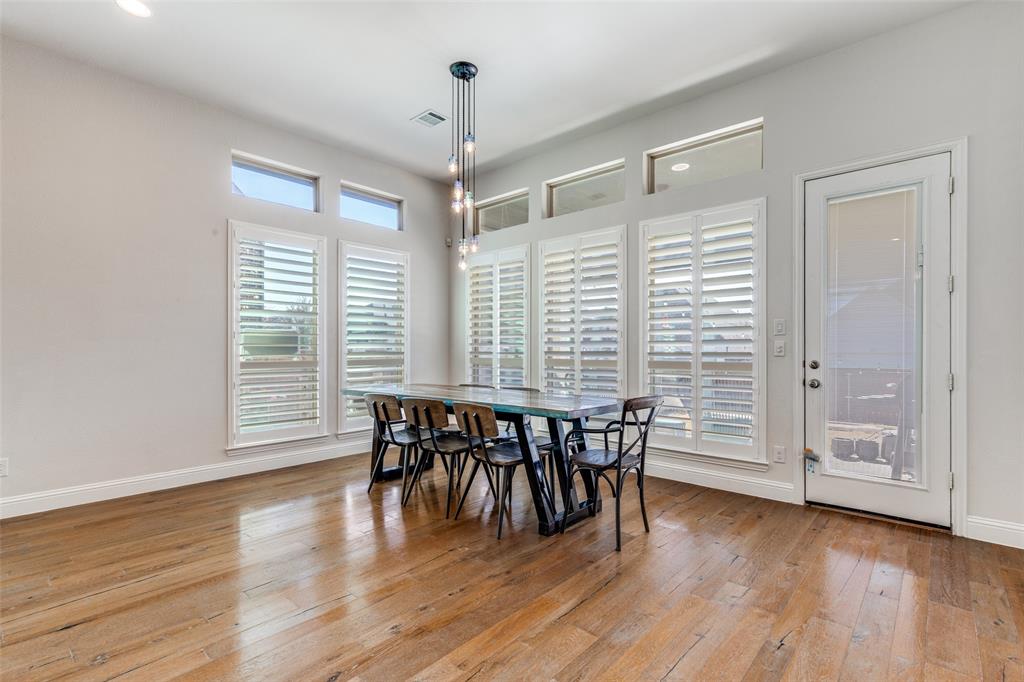 15193 Basket Oak Road Frisco, TX 75035 - Photo 10 of 40 an empty room with wooden floor and furniture