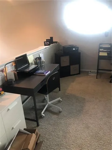 a roof deck with table and chairs