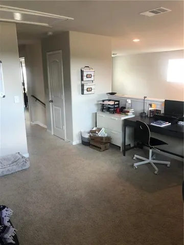 a view of a workspace with furniture