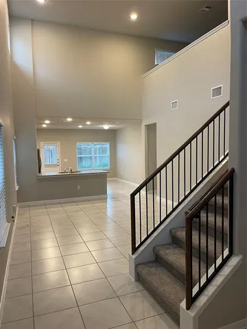 a view of staircase with white walls
