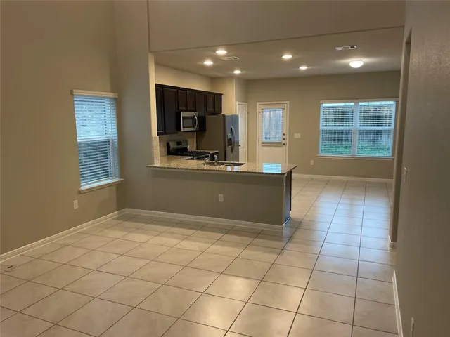 a view of kitchen with windows