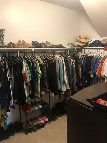 a view of a closet with storage