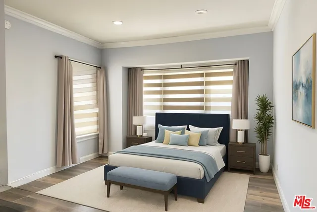 a bedroom with a large bed and a large window