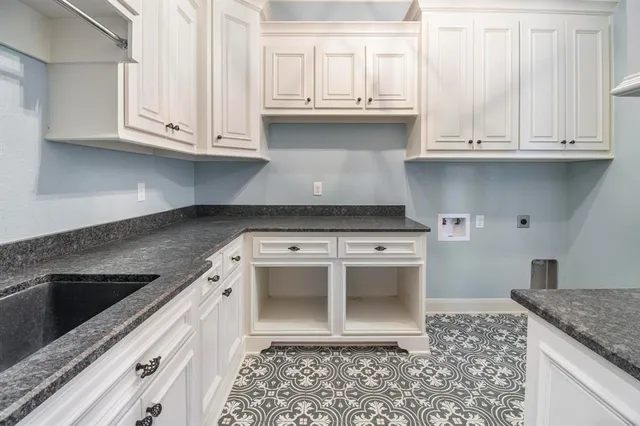 a white stove top oven sitting inside of a kitchen