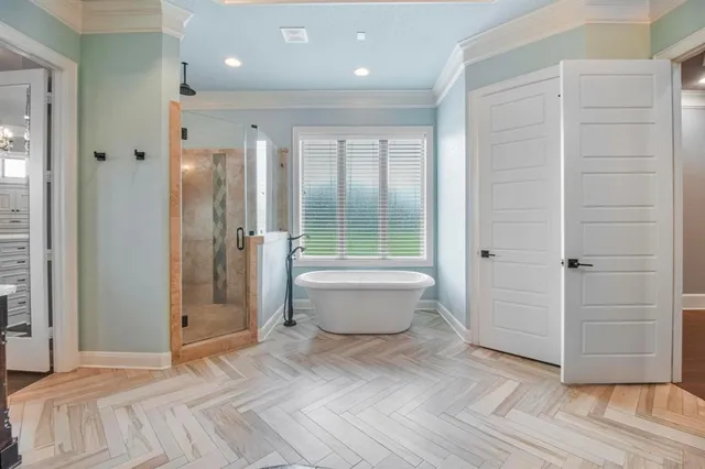 a bathroom with a bathtub and shower