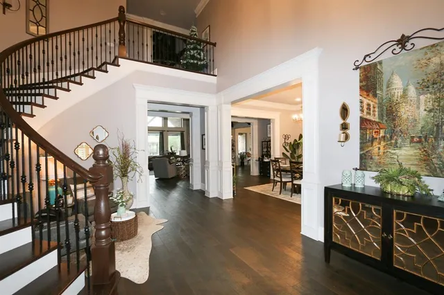 a view of living room and wooden floor