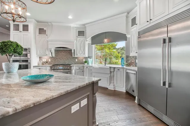 a kitchen with refrigerator and window