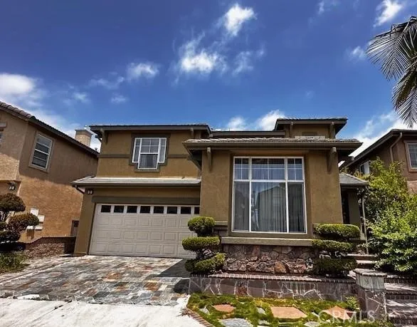 a front view of a house with swimming pool