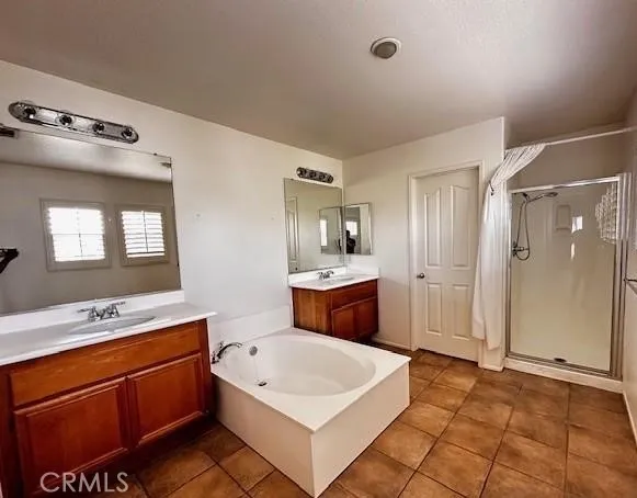 a large white kitchen with a sink a stove and a refrigerator