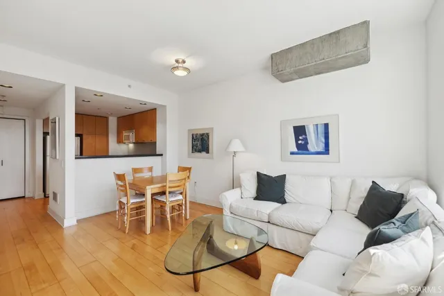 a dining room with furniture and wooden floor